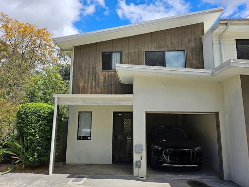 Professional Gold Coast painter completing a residential home painting project.